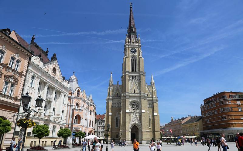 people walking along buildings in Serbia