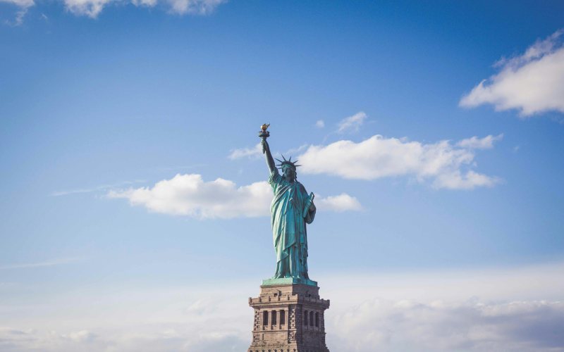  Statue of Liberty in New York under blue sky