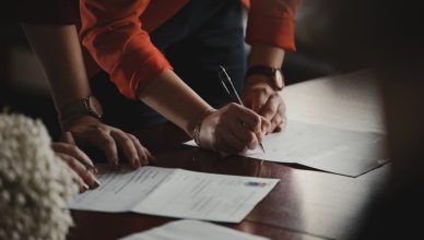 documents being signed by a man