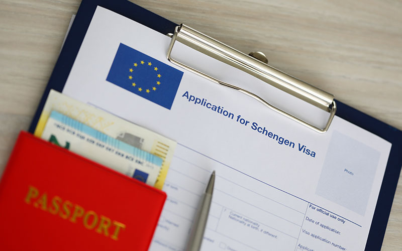 On the table is an application for Schengen Visa