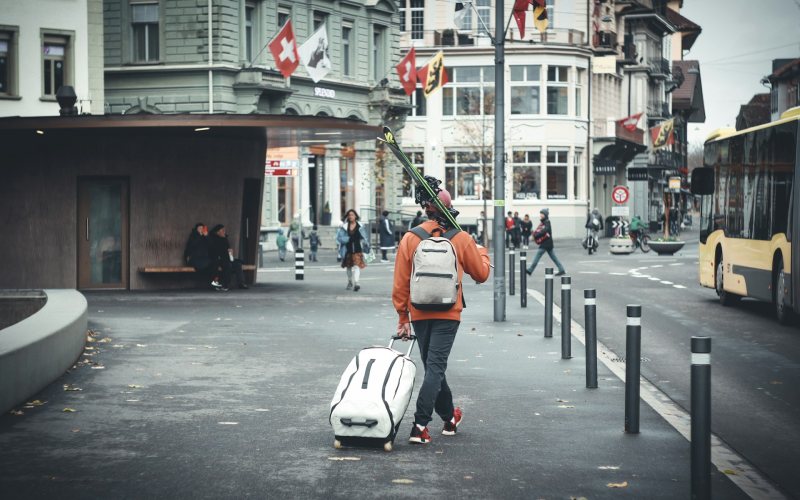 A traveller in orange jacket.